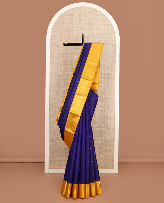 Blue zari buttas silk saree, contrast border of thilakam mokku, manga and floral designs, and jaal pallu