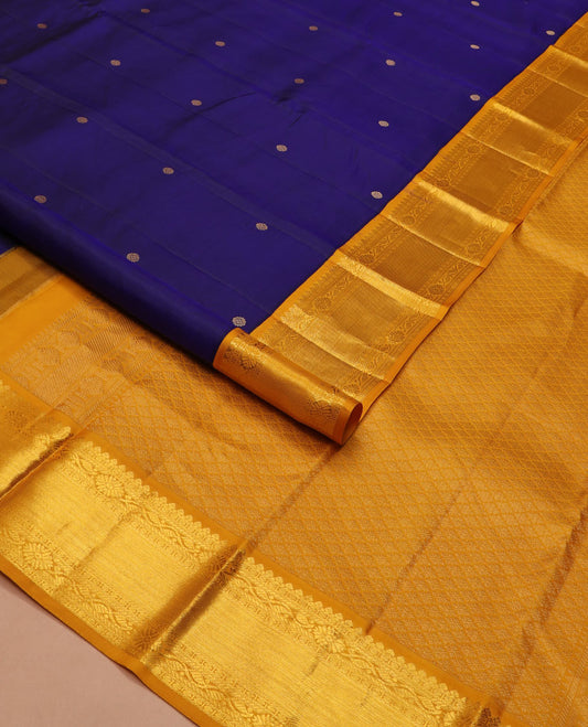 Blue zari buttas silk saree, contrast border of thilakam mokku, manga and floral designs, and jaal pallu