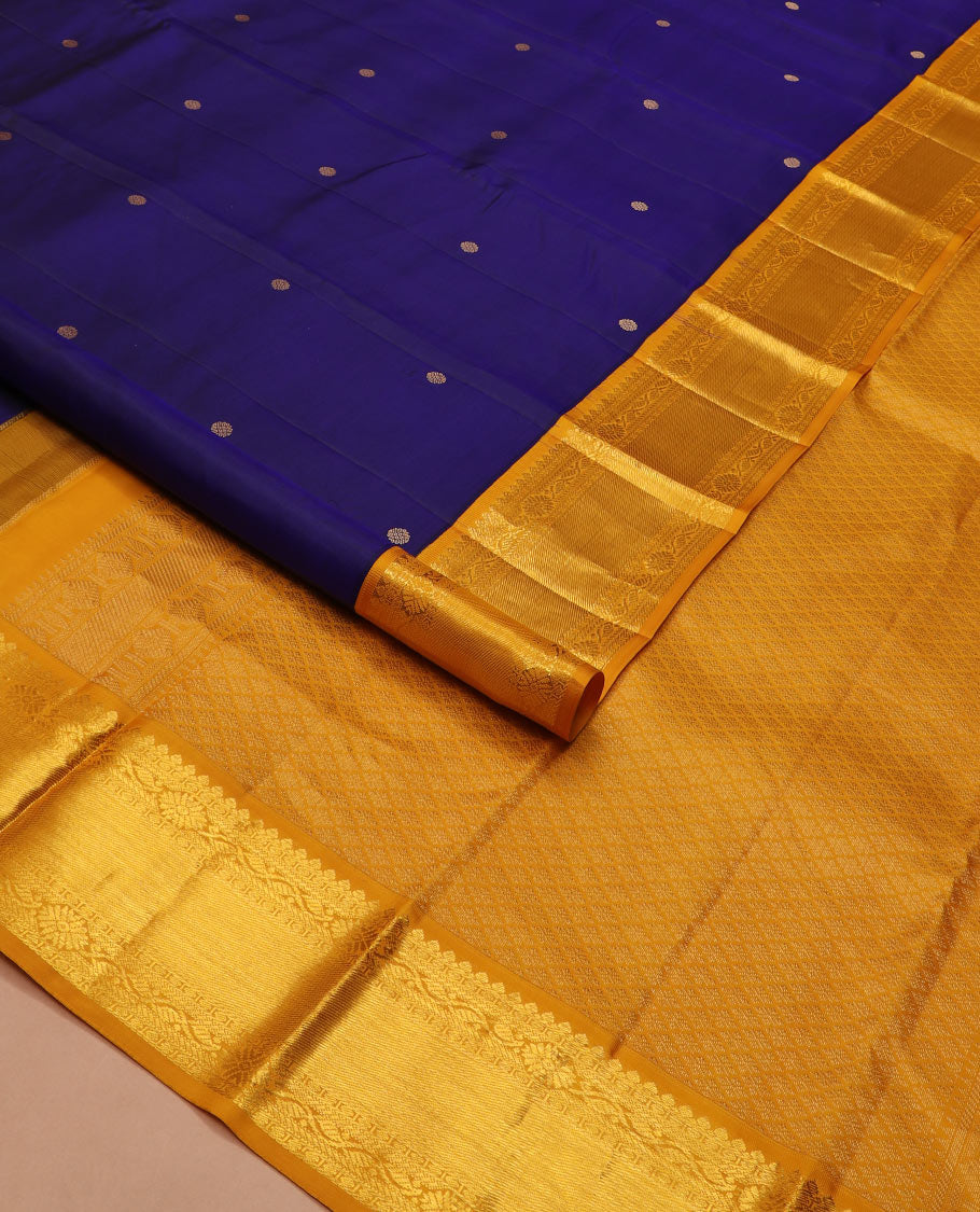 Blue zari buttas silk saree, contrast border of thilakam mokku, manga and floral designs, and jaal pallu