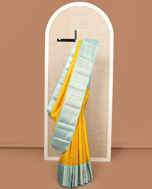 Yellow zari buttas silk saree, contrast border of rekku, muthu, kodi manga, kodi visiry, mayil kann, and rudraksham designs, and jaal pallu