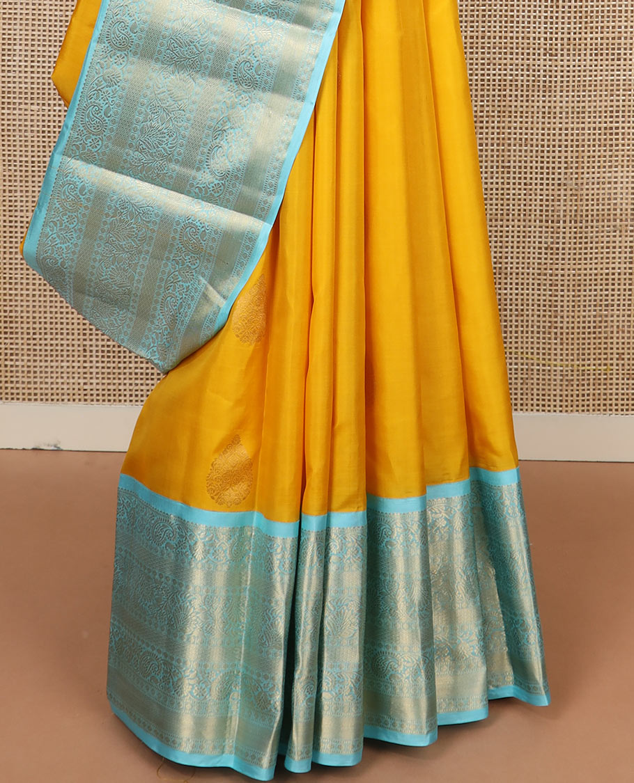 Yellow zari buttas silk saree, contrast border of rekku, muthu, kodi manga, kodi visiry, mayil kann, and rudraksham designs, and jaal pallu
