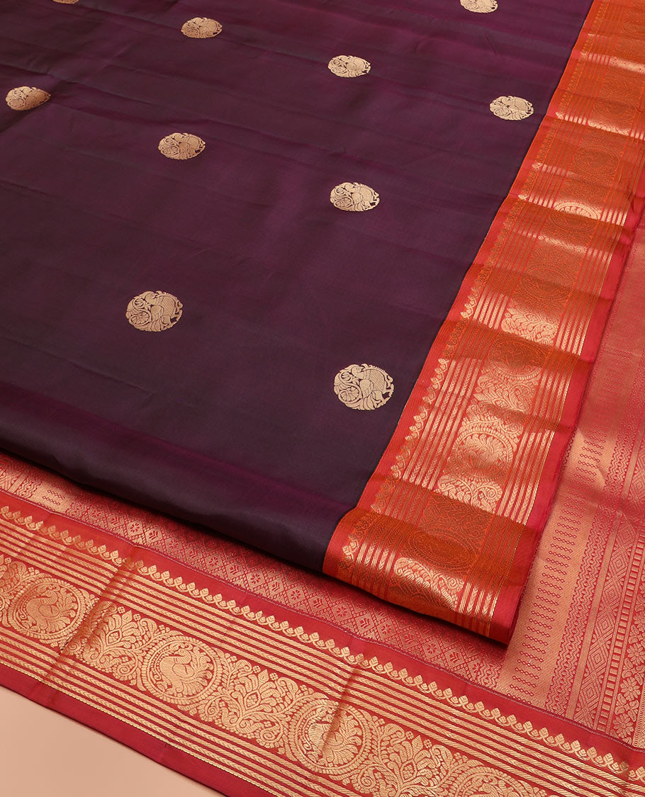 Purple Vasundhara Silk Saree Enthralled with Round Mayil Buttas, Highlighted with a Contrast Border of Thilakam Mokku, Kathir, Banaras, and Mayil Designs, Pallu Decorated with Jaal Design, and Paired with a Contrast Blouse