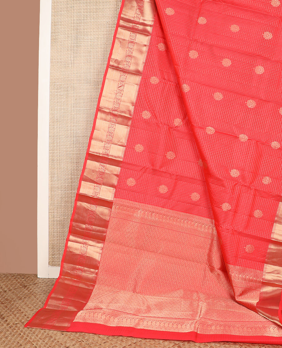 Red micro-checked and buttas silk saree, zari border of thilakam mokku, neli, zari stripes, and kodi visiry designs, and ogee patterned pallu