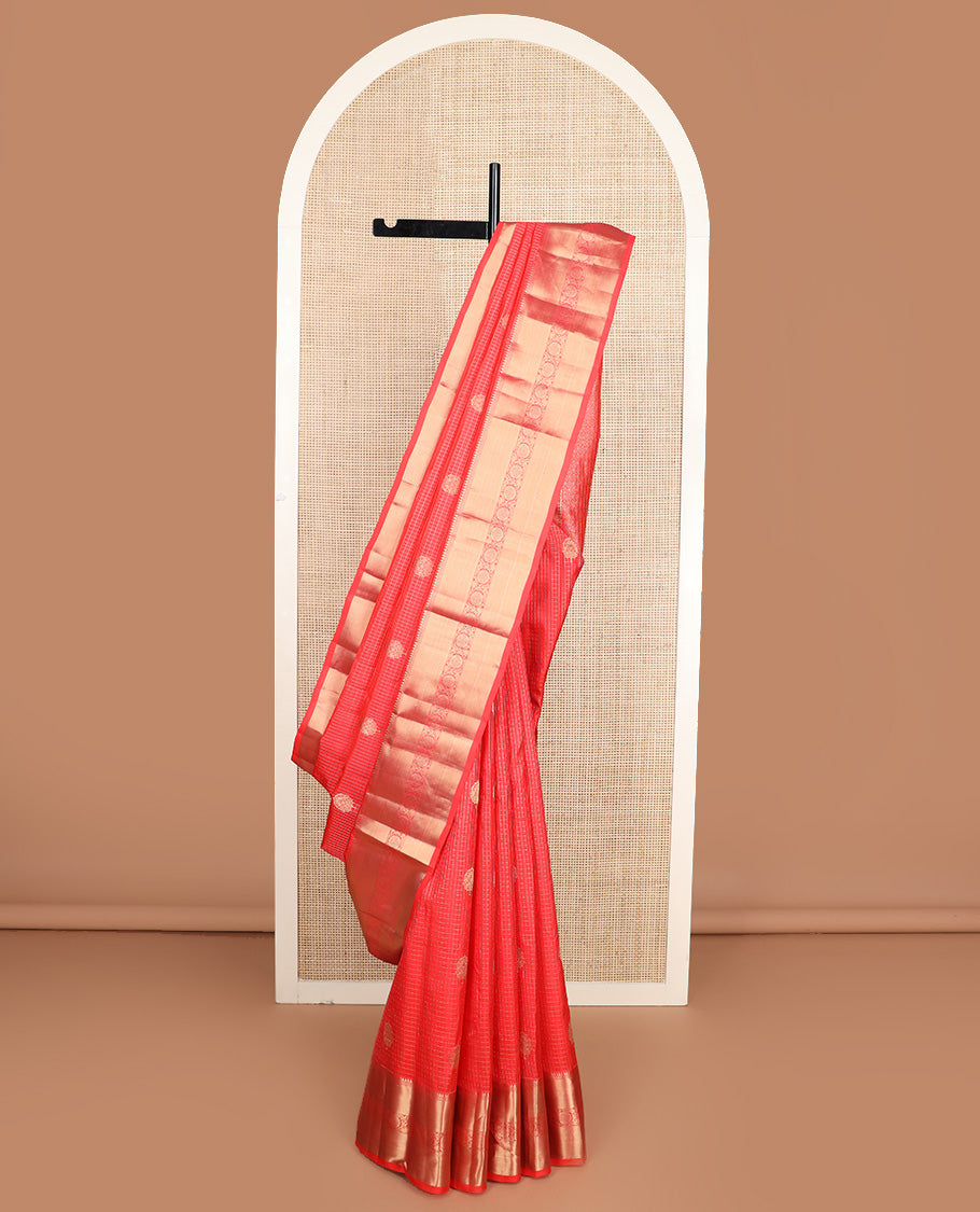 Red micro-checked and buttas silk saree, zari border of thilakam mokku, neli, zari stripes, and kodi visiry designs, and ogee patterned pallu