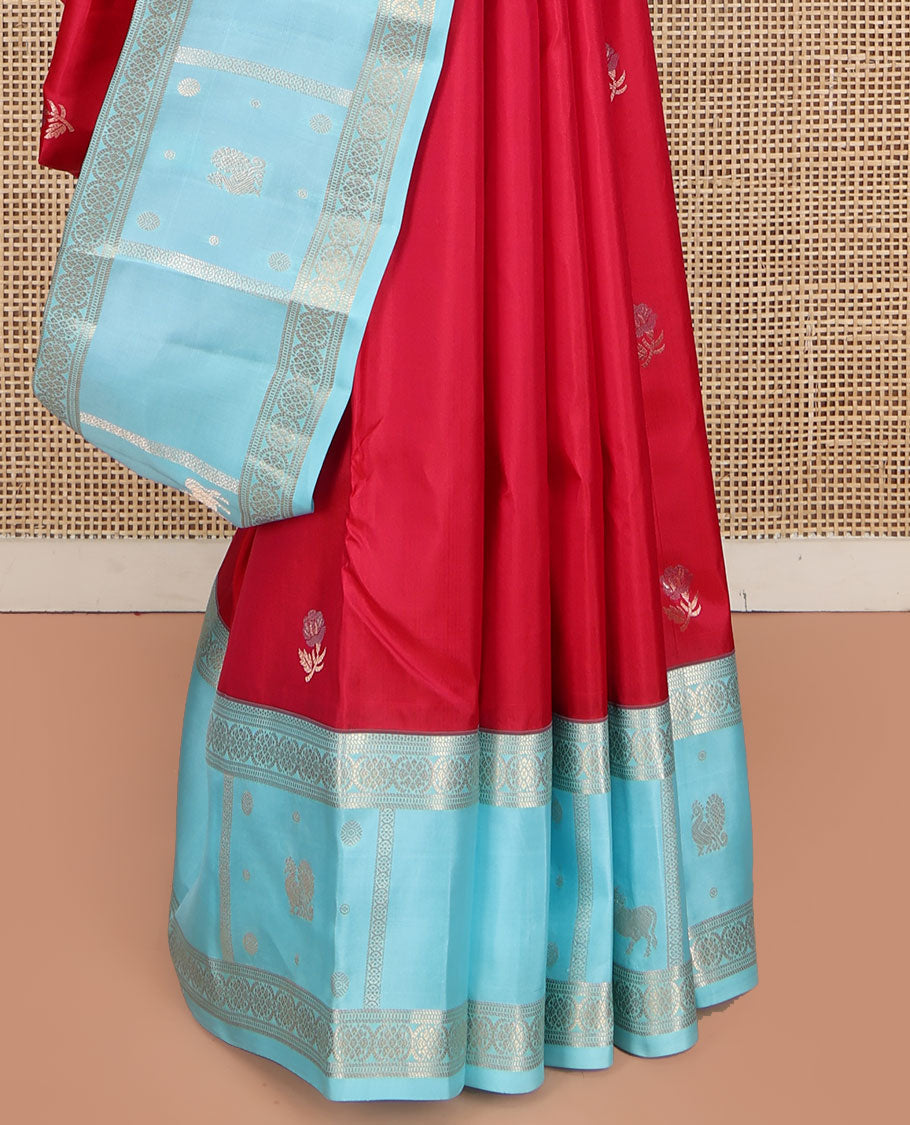 Red Vasundhara Silk Saree, Embellished with Floral Buttas on Its Body, Complemented by Contrast Border of Kodi Visiry, Annam, Pichwai Cow and Lotus Designs, Meticulously Crafted Pallu, and Paired with a Contrast Blouse
