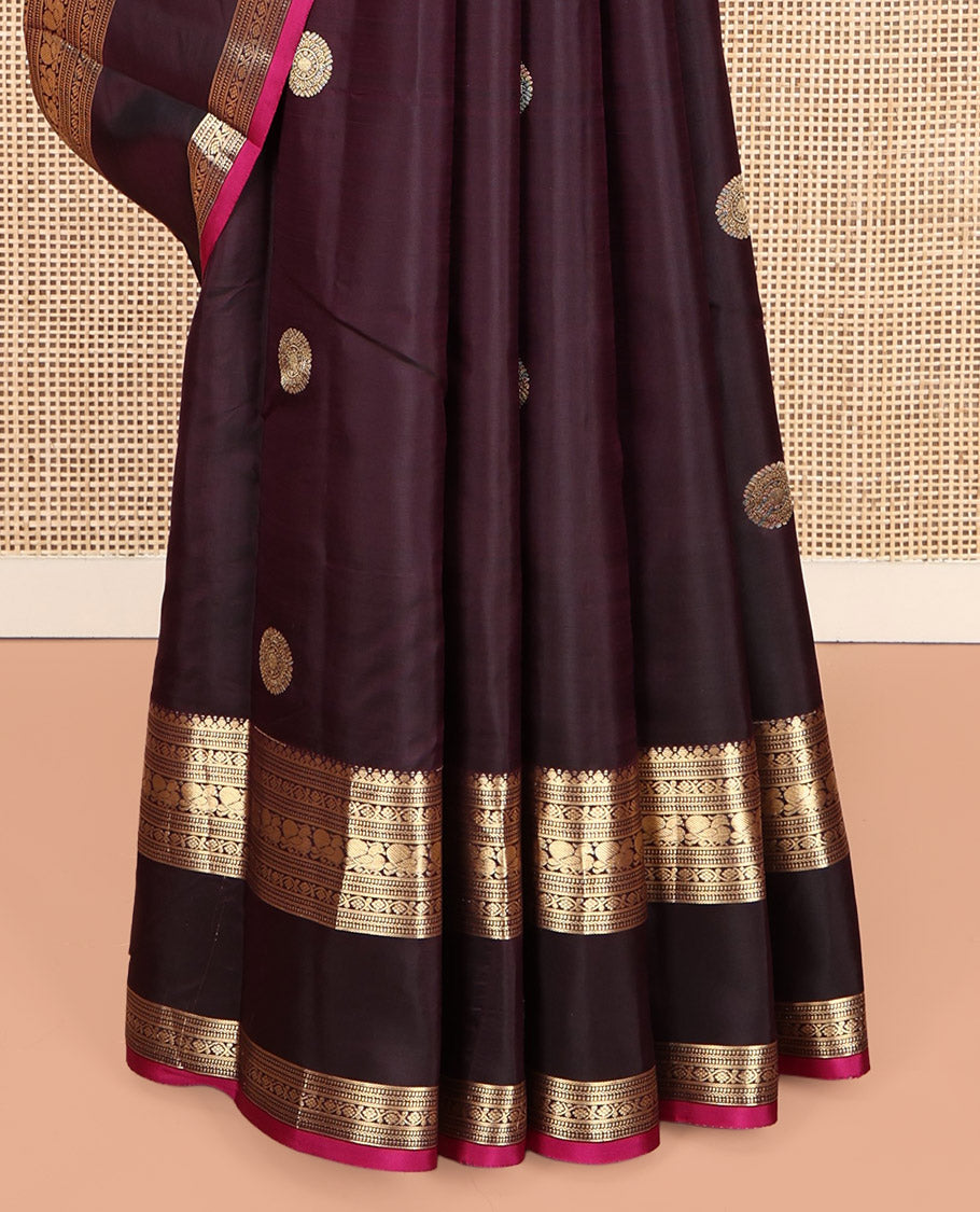 Maroon Vasundhara Silk Saree, Spotlighted with Chakram Buttas, a Rettai Pettu Border of Muthu, Kodi Visiry, and Mayil Designs, Contrast Grand Pallu, and a Contrast Blouse