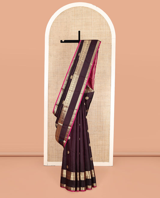 Maroon Vasundhara Silk Saree, Spotlighted with Chakram Buttas, a Rettai Pettu Border of Muthu, Kodi Visiry, and Mayil Designs, Contrast Grand Pallu, and a Contrast Blouse