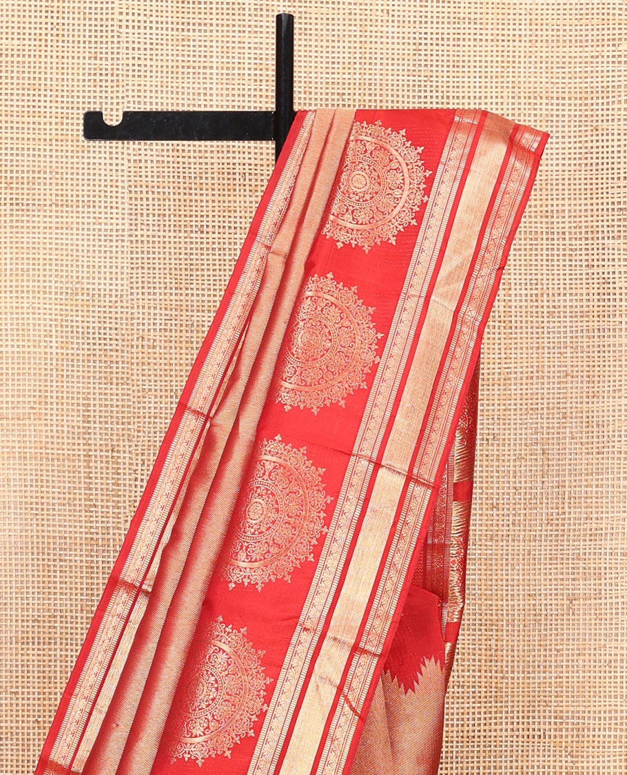 Red Kanchipuram Wedding Silk Saree, Gleamed Up with Zari and Chakram Designs on Its Body, Highlighted by a Zari Border of Muthu, Kamalam, and Vanki Designs, Intricately Designed Pallu, and Paired with a Matching Blouse
