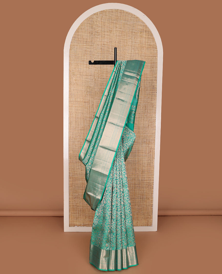 Turquoise jacquard Kanchipuram wedding silk saree, zari border of kathir, mayil kann, rettai neli, and lavangam kodi designs, and manga design pallu