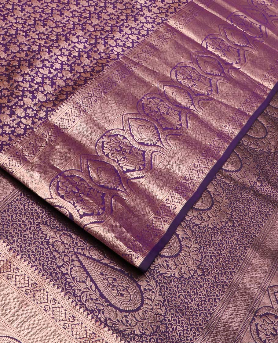 Purple jacquard wedding silk saree, zari border of thilakam mokku, muthu, diamond, jaal, and floral designs, and intricate pallu