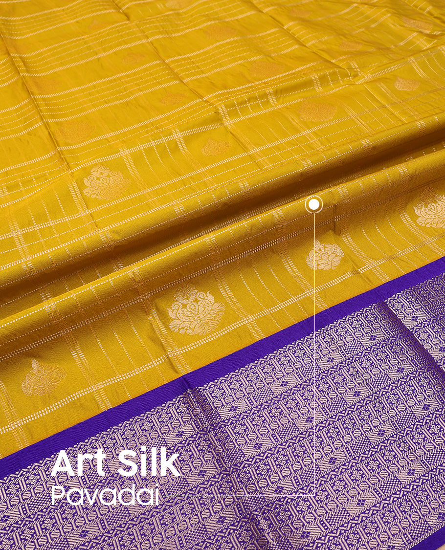 Mustard silk pavadai set, embossed, zari design with contrast traditional zari bordered skirt and a contrast zari design blouse