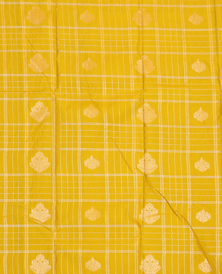 Mustard silk pavadai set, embossed, zari design with contrast traditional zari bordered skirt and a contrast zari design blouse