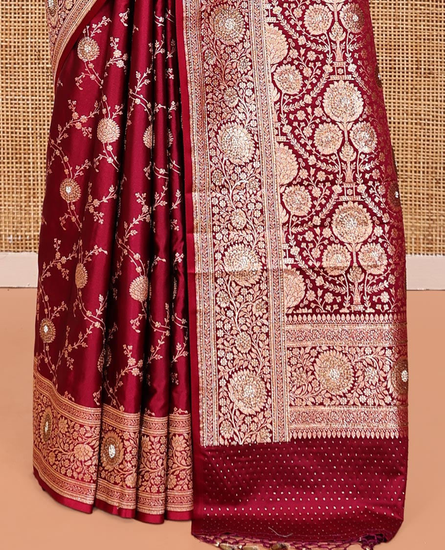 Red Wine Banarasi Satin Saree, Gleamed Up with Floral Jaal Jacquard, a Floral Creeper Border, Intricate Stonework Pallu, and a Matching Blouse