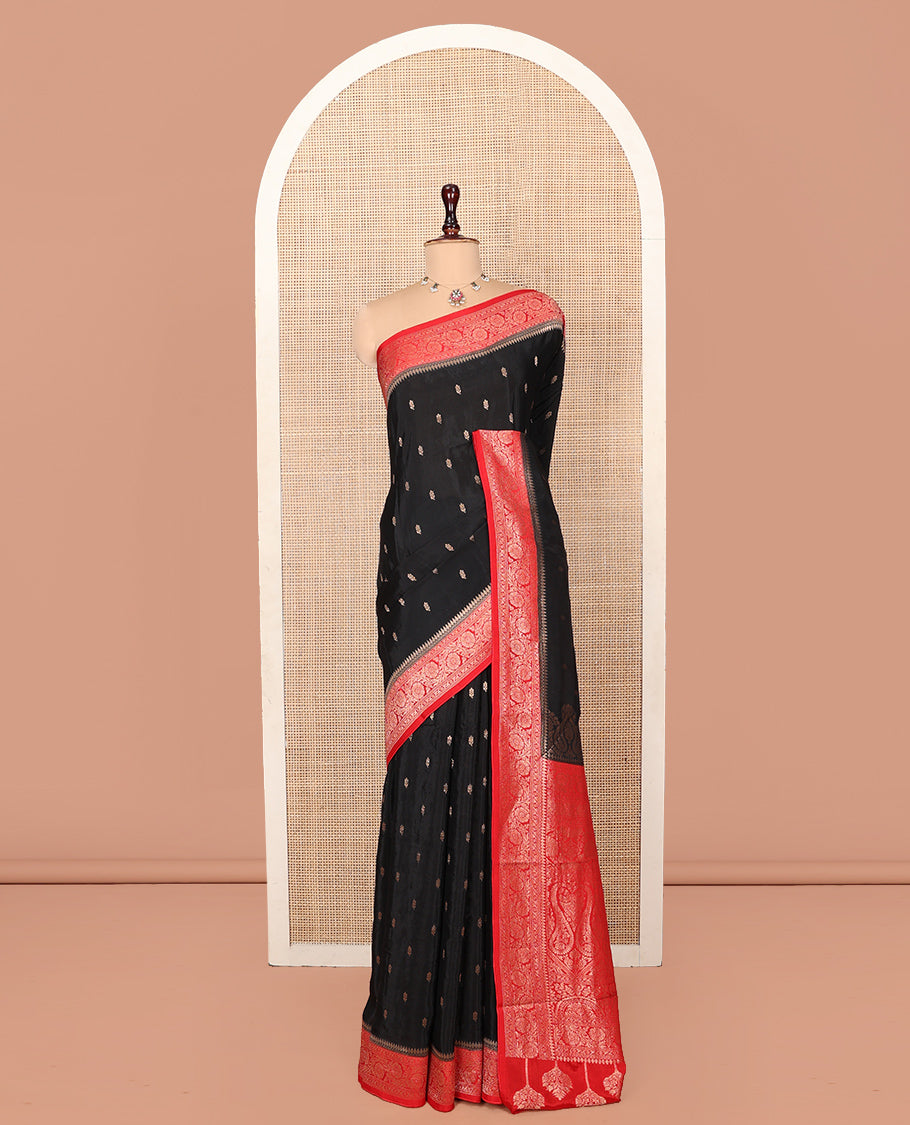 Black Fancy Crepe Saree, Spotlighted with Buttas, Complemented by a Contrast Floral Creeper Border, Intricately Designed Pallu, and a Contrast Blouse