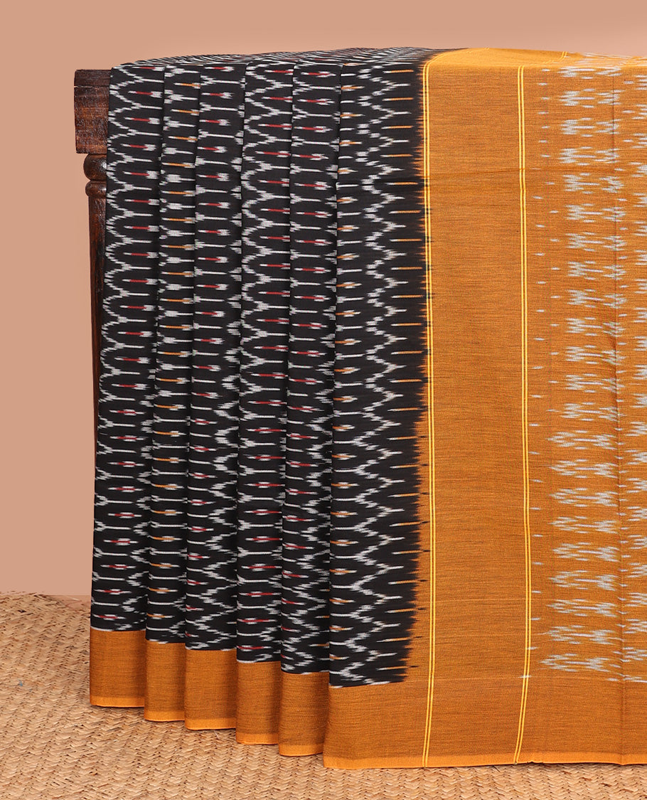 Black ogee patterned ikkat cotton saree, contrast plain border, and pallu of buttas