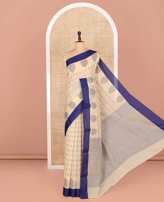 Cream Semi-Silk Cotton Saree, Bedecked with Unique Designs All Over Its Body, Complemented by a Contrast Border, Pallu of Intricate Designs, and Paired with a Matching Blouse