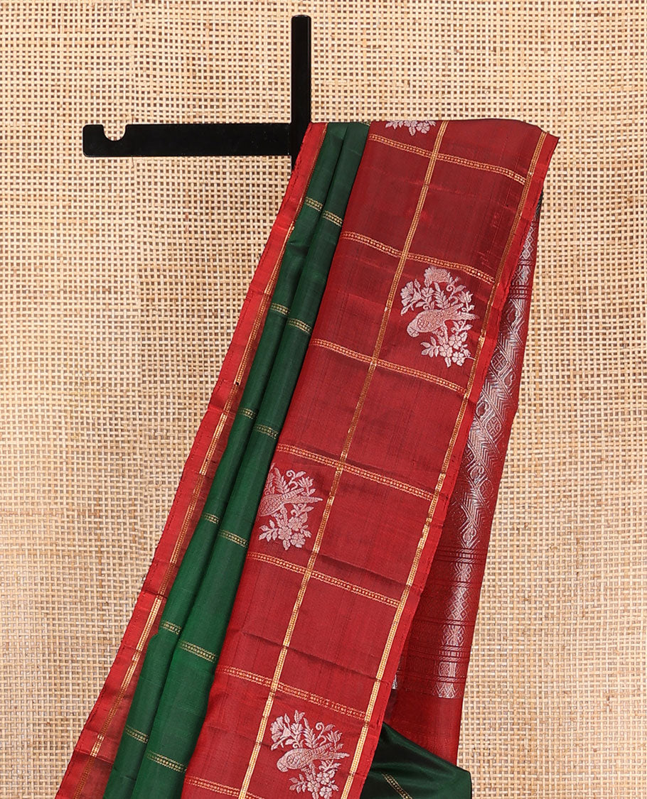 Green zari design Kanchipuram silk saree, contrast zari buttas enclosed checked border, and pallu of manga, rudraksham, and kathir designs