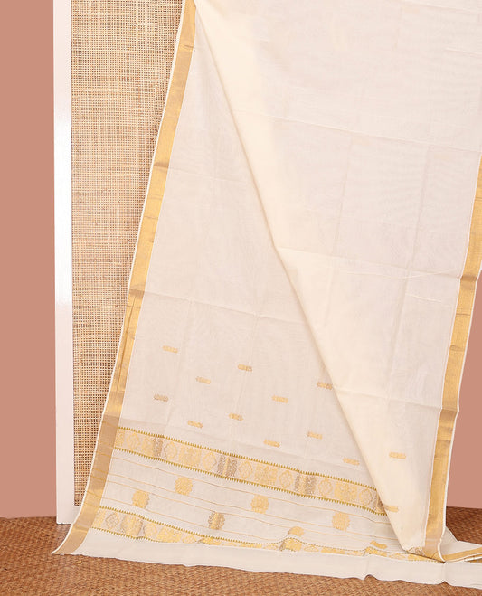 Cream Kerala Saree, Subtly Woven with Zari Buttas on Its Body, Bavanji Zari Border, Pallu of Zari Designs, and Paired with a Matching Blouse