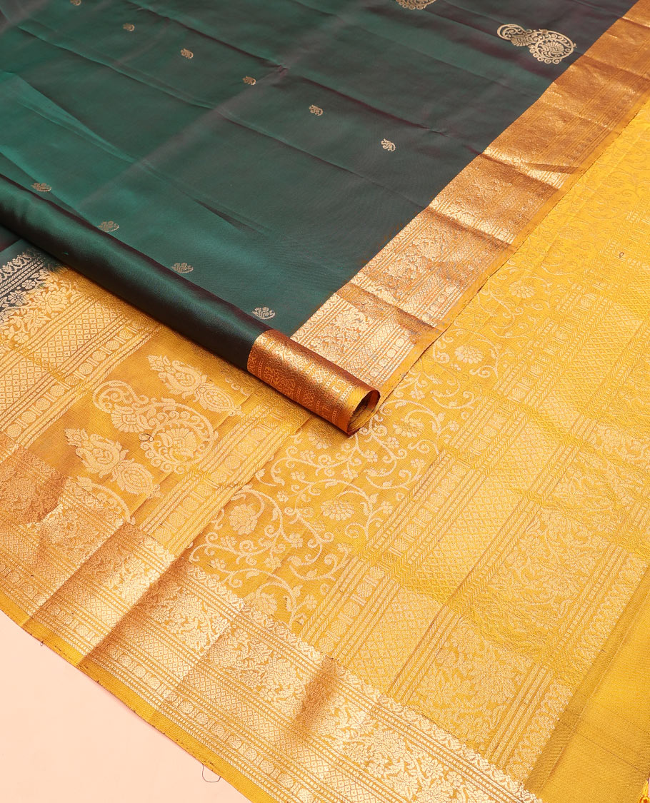 Green zari buttas soft silk saree, contrast border of salngai, muthu, banaras, kodi visiry, rudraksham, and mayil kann, and floral vine pallu