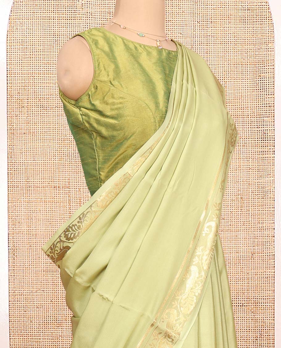 Green Plain Mysore Silk Saree, Highlighted by a Traditional Zari Border of Peacock Designs, Pallu Steeped with Zari Stripes, and Paired with a Matching Blouse