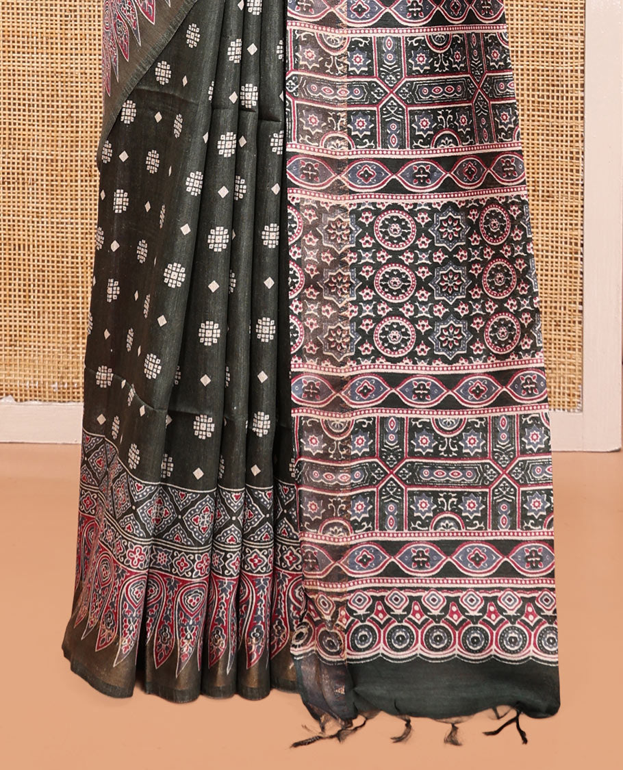 Black Tussar Silk Saree, Adorned with Buttas, Artfully Designed Ajrakh Printed Border, a Pallu of Ajrakh Print, and a Contrast Blouse