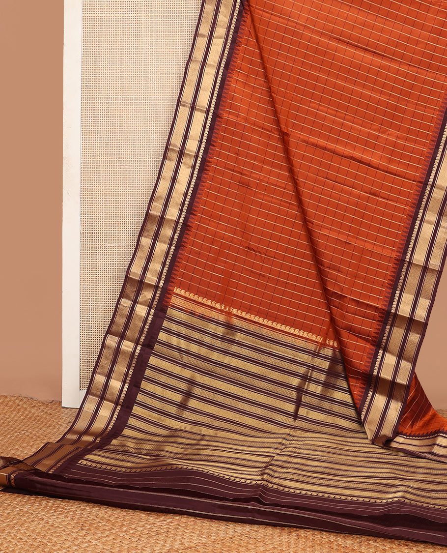 Orange checked Vasundhara soft silk saree, contrast temple border of manga mokku, muthu & mayil kann & zari design pallu