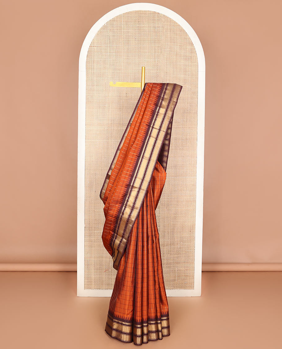 Orange checked Vasundhara soft silk saree, contrast temple border of manga mokku, muthu & mayil kann & zari design pallu