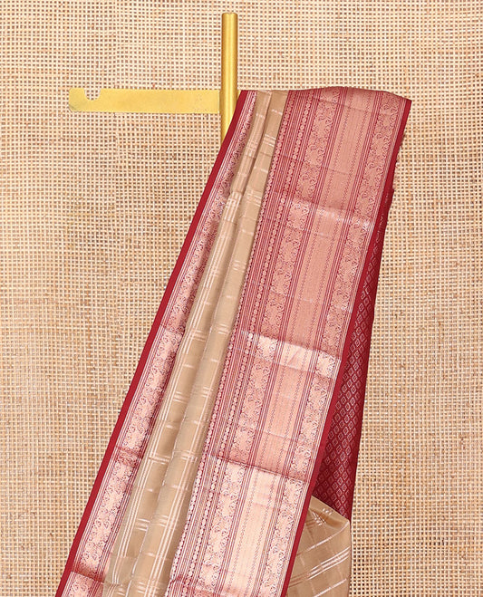 Sandal Vasundhara Silk Saree Elevated with Zari Stripes All Over Its Body, Complemented by a Contrast Border of Manga, Rudraksham, Yaali, Neli, and Muthu Designs, Zari Rich Jaal Pallu, and Paired with a Contrast Blouse