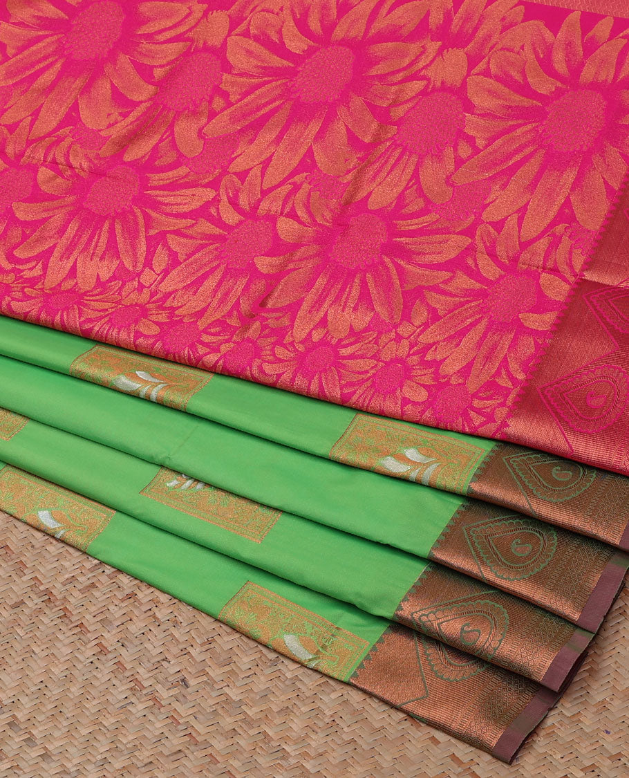 Green semi-soft silk saree with zari buttas, traditional zari border & contrast pallu of floral designs