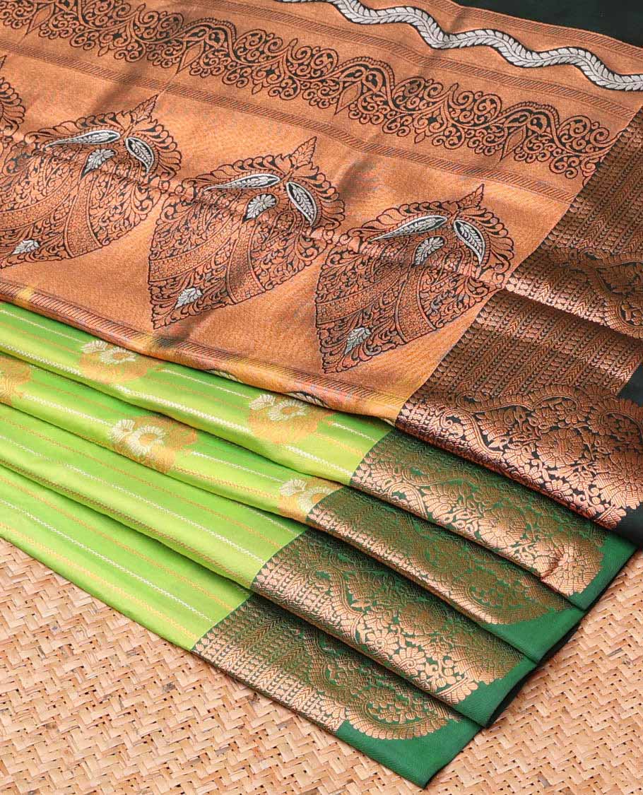 Green semi-soft silk saree with zari designs, contrast zari border & pallu steeped with intricate designs