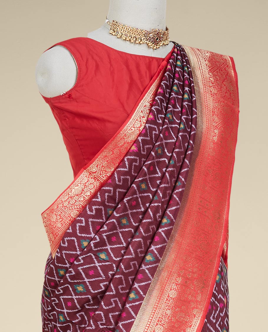Brown ikkat-style geometric pattern & meena buttas dola silksaree, contrast border & pallu features intricate designs