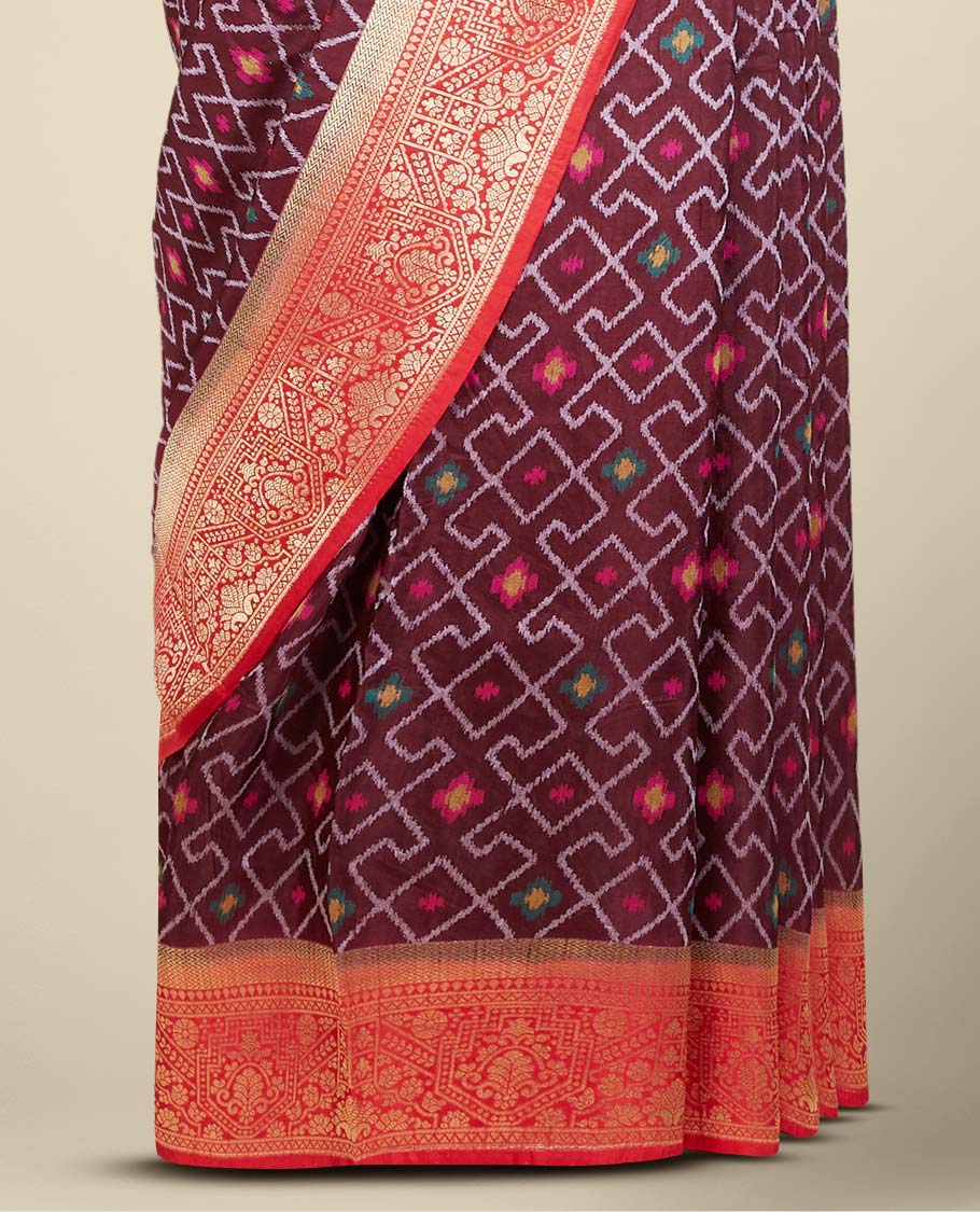 Brown ikkat-style geometric pattern & meena buttas dola silksaree, contrast border & pallu features intricate designs