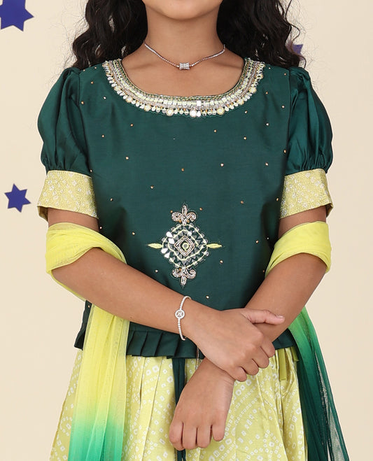Yellow cholly set features floral & bandhani printed skirt, contrast embroidered puff-sleeve blouse & net dupatta