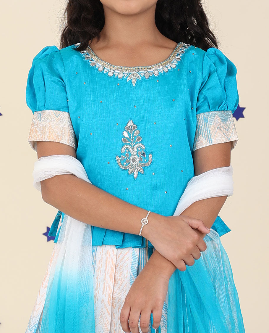Cream cholly set features jacquard & traditional zari border skirt,contrast embroidered puff-sleeve blouse & net dupatta