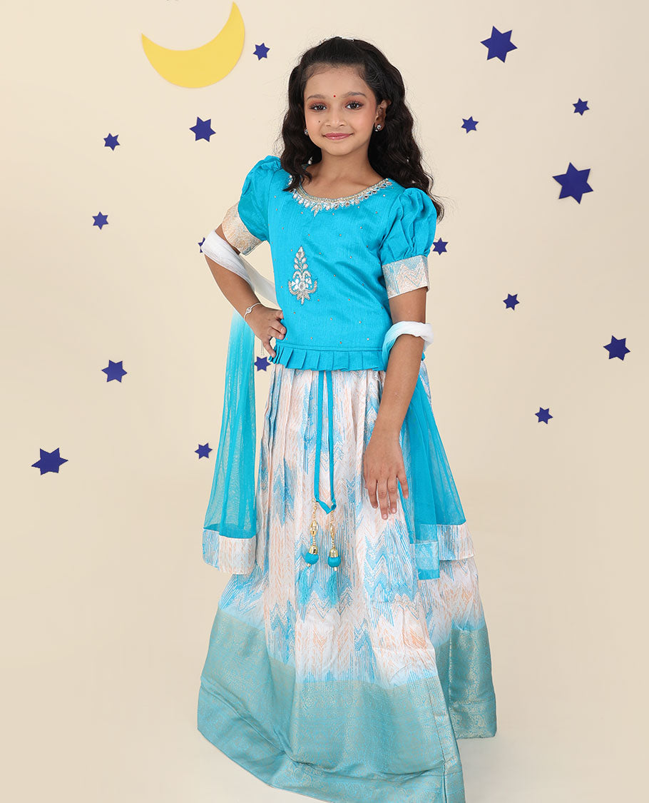 Cream cholly set features jacquard & traditional zari border skirt,contrast embroidered puff-sleeve blouse & net dupatta
