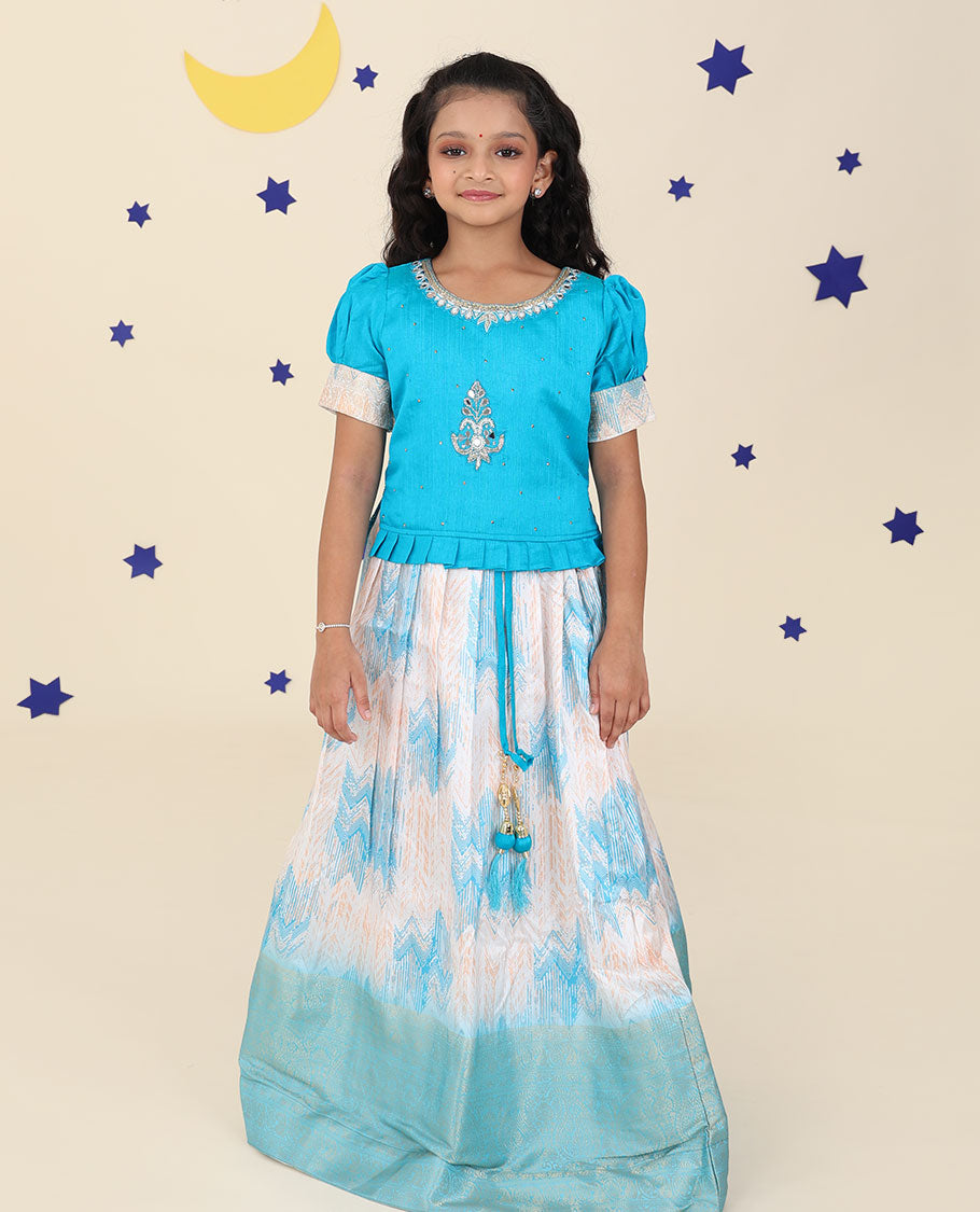 Cream cholly set features jacquard & traditional zari border skirt,contrast embroidered puff-sleeve blouse & net dupatta