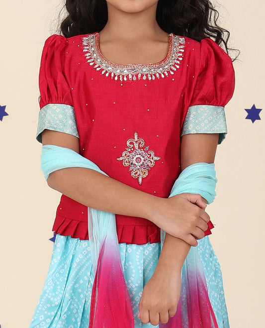 Blue cholly set features floral & bandhani printed skirt, contrast embroidered puff-sleeve blouse & net dupatta
