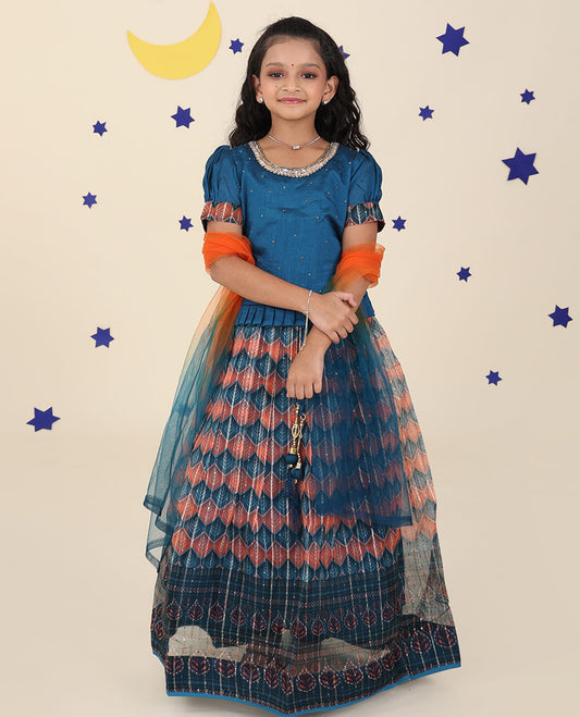 Blue cholly set features intricately printed skirt, embroidered puff-sleeve blouse & net dupatta