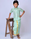Pista green art-silk boys dhoti set features a solid half-sleeve shirt & zari border velcro dhoti 