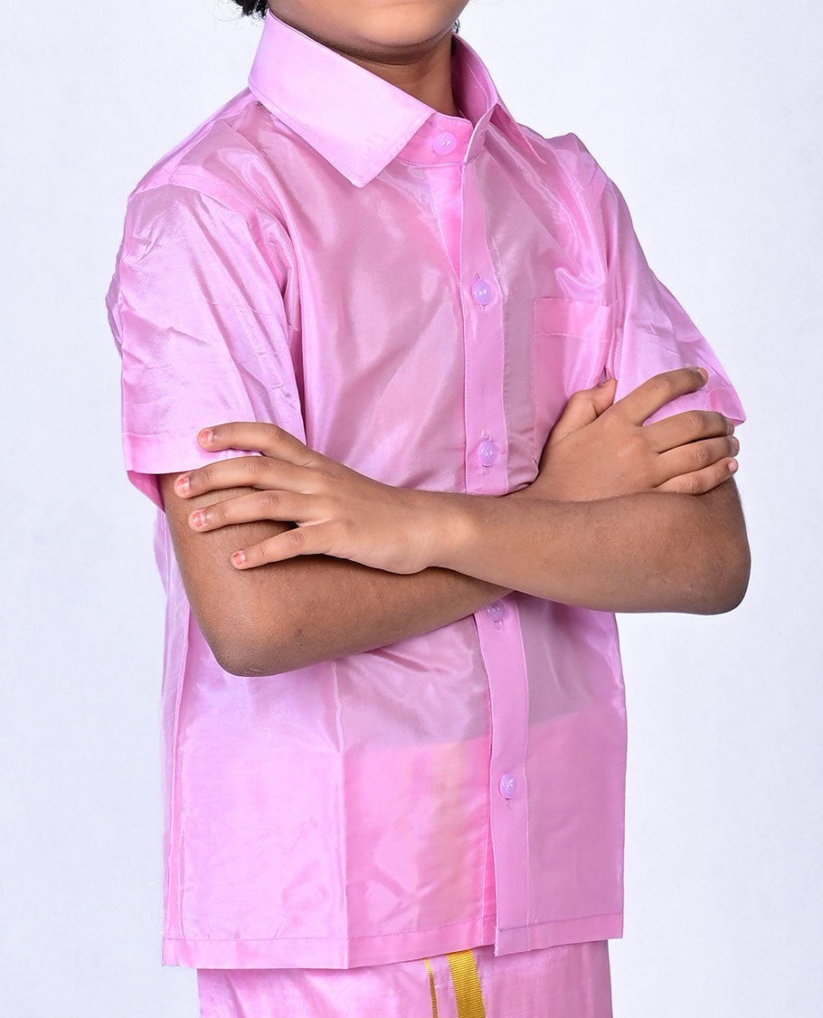 Pink art-silk boys dhoti set features a solid half-sleeve shirt & zari border velcro dhoti 