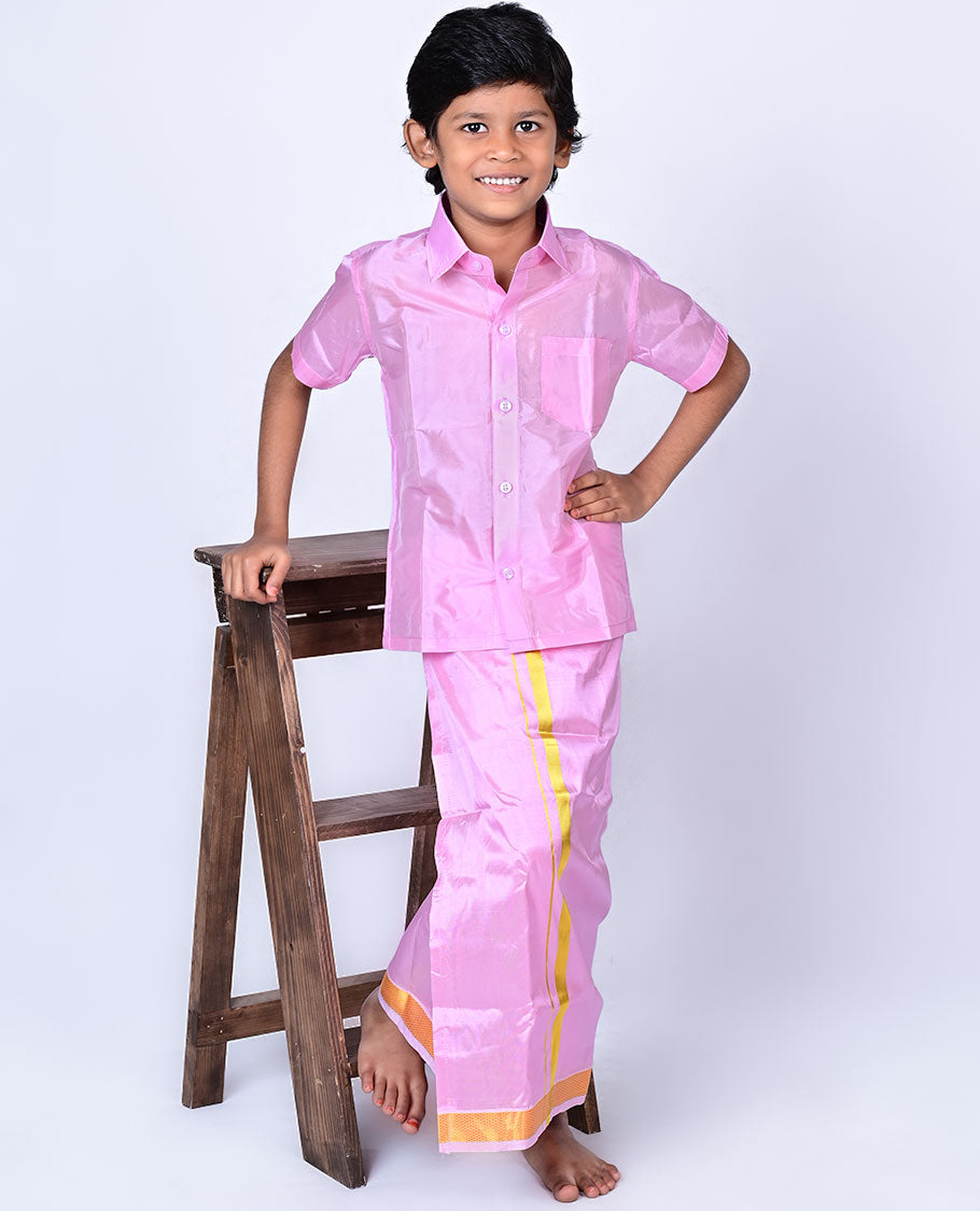 Pink art-silk boys dhoti set features a solid half-sleeve shirt & zari border velcro dhoti 