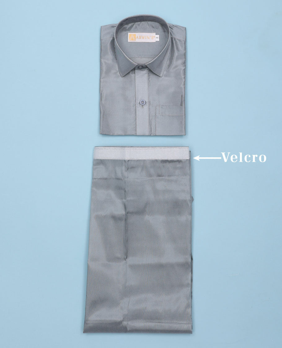 Grey art-silk boys dhoti set features a solid half-sleeve shirt & zari border velcro dhoti 