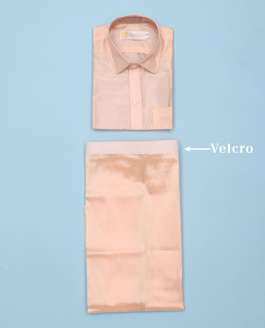 Coral art-silk boys dhoti set features a solid half-sleeve shirt & zari border velcro dhoti 