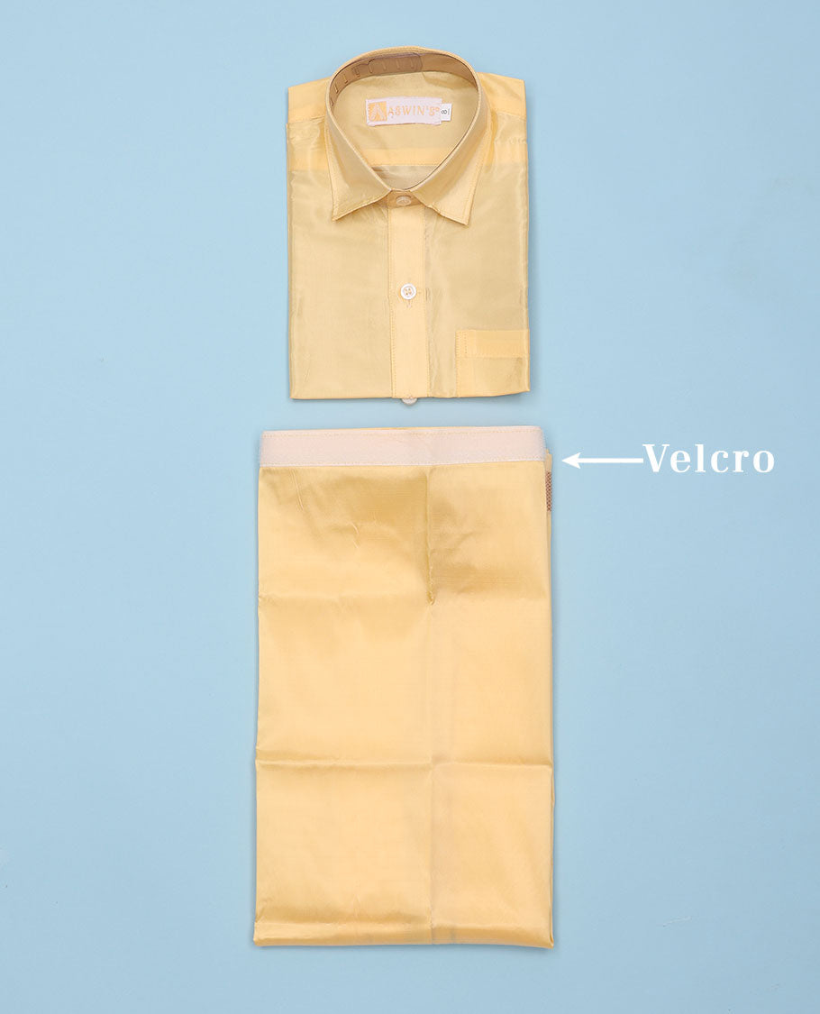 Gold art-silk boys dhoti set features a solid half-sleeve shirt & zari border velcro dhoti 