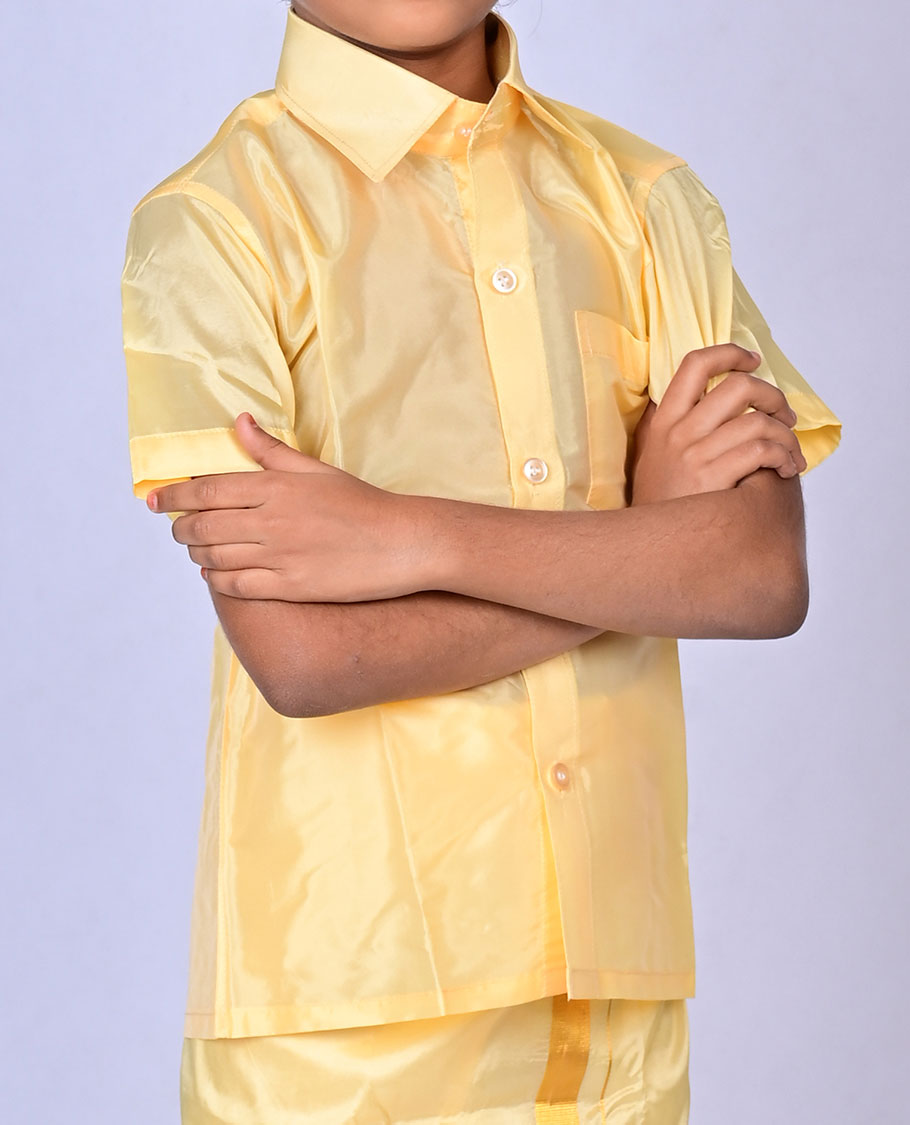 Gold art-silk boys dhoti set features a solid half-sleeve shirt & zari border velcro dhoti 