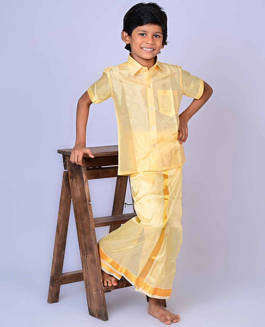 Gold art-silk boys dhoti set features a solid half-sleeve shirt & zari border velcro dhoti 