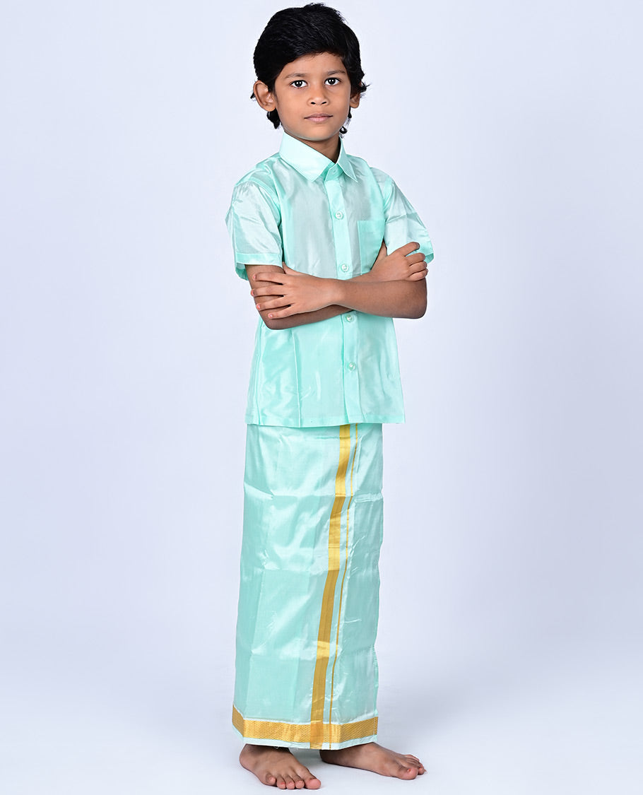 Mint green art-silk boys dhoti set features a solid half-sleeve shirt & zari border velcro dhoti 