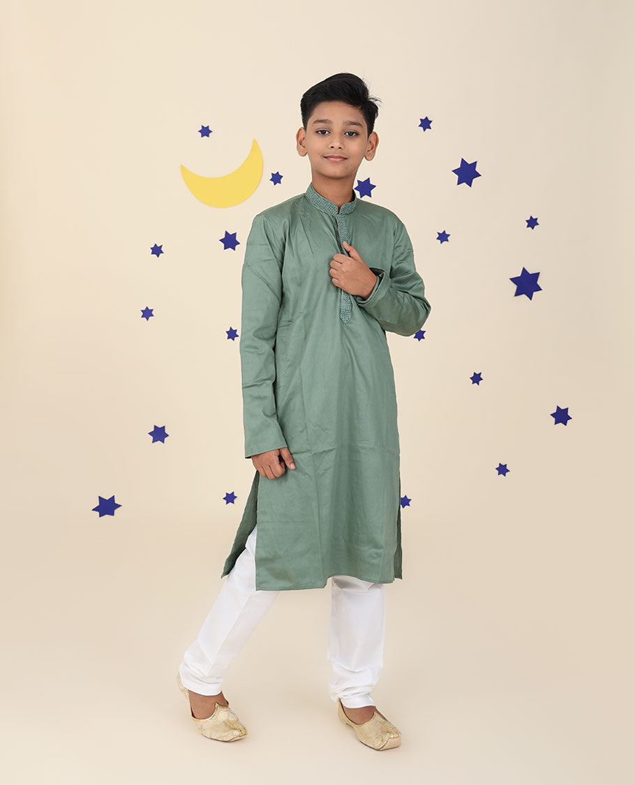 Green raw-silk kurta set features solid full-sleeve kurta & contrast pants