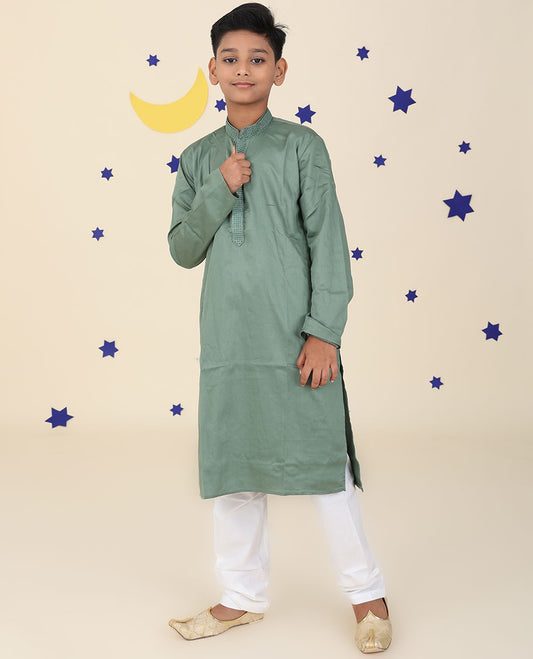 Green raw-silk kurta set features solid full-sleeve kurta & contrast pants