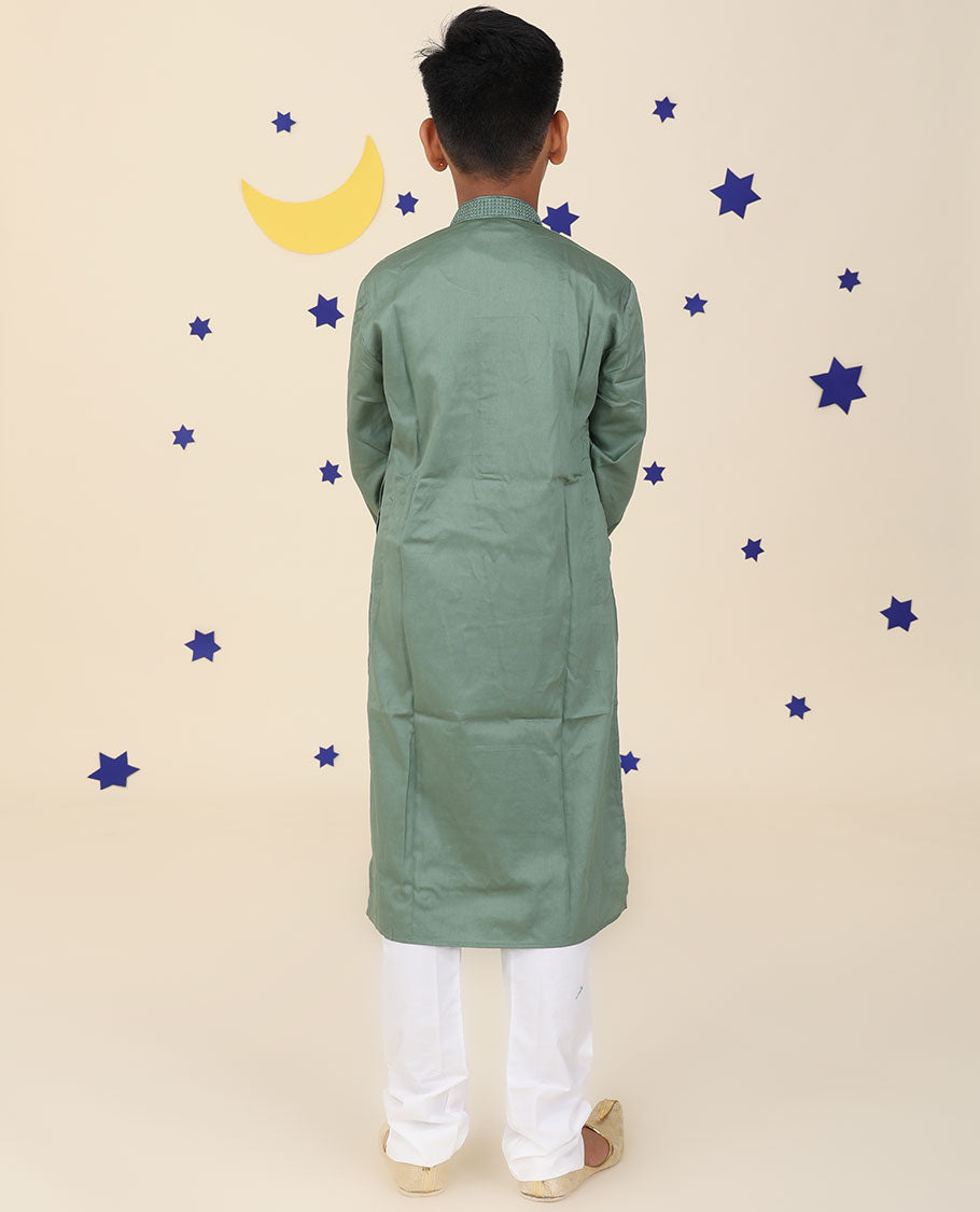 Green raw-silk kurta set features solid full-sleeve kurta & contrast pants